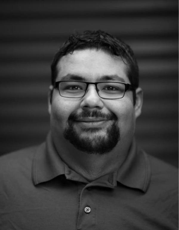 Black and White headshot of Director PJ Germain