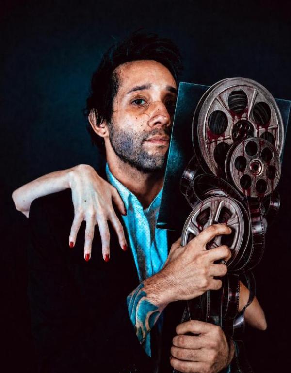 Director Samuel Gonzalez Jr. in a cinematic portrait representing his horror film THE REVIEW.