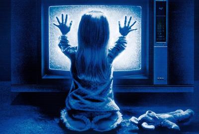 Poltergeist poster with little girl with hands on her tv