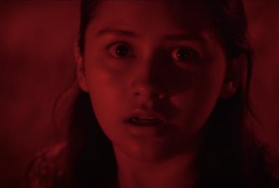 Young girl terrified at night.