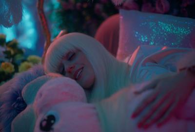 A woman sleeps soundly with her pink stuffed animal