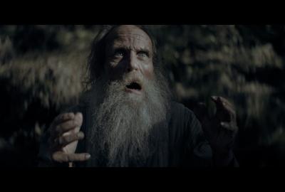 The old man with a beard yells