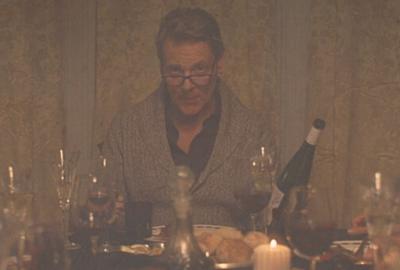 vintage photo of man sitting at the dinner table