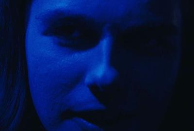Dennis scary bathed in blue light